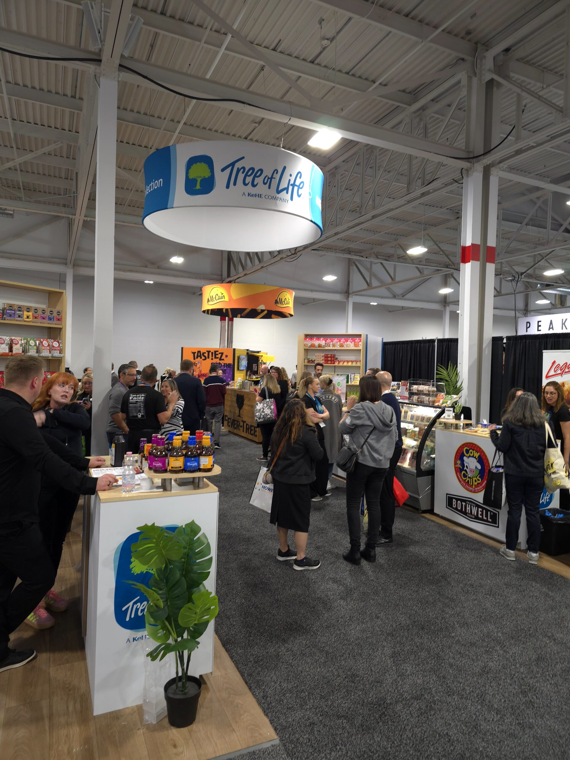 Image of a trade show and people walking around.